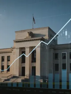 Federal Reserve building with financial graphs showing shifting rate hike expectations.