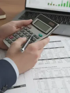 Person calculating potential savings from 2026 federal benefits